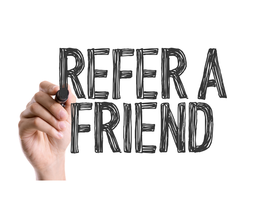Hand writing the words Refer a Friend